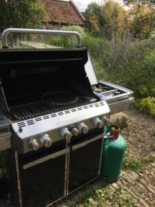 BBQ open showing grill and hot plate