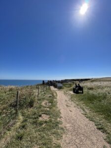 Coastal path along cliffs in sunshine