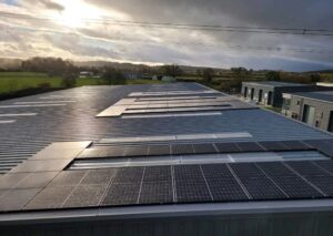 Solar panels on a flat roof at Roost Coffee.