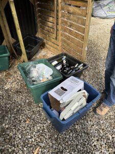 Recyling bins full of rubbish 