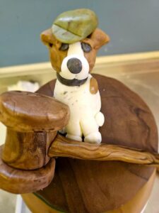 Chocolate birthday cake with jack russel and gavel on the top