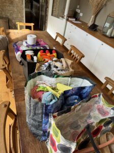 Cleaning materials in bags on a wooden table