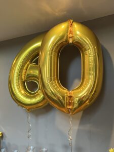 Gold sixtieth birthday helium ballons