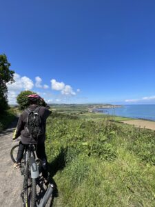 Man on bike looking at sea view