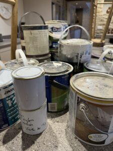 Collection of paint and varnish tins